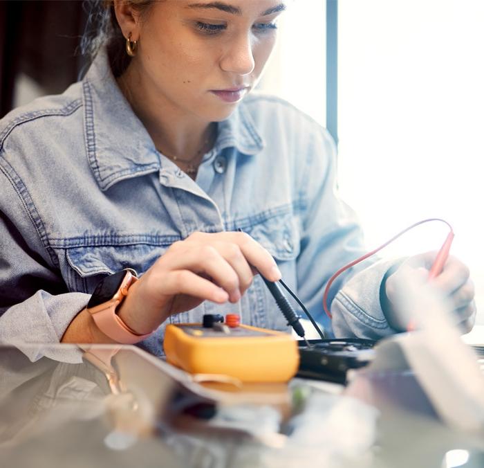 A high school student engaging in a semiconductor activity